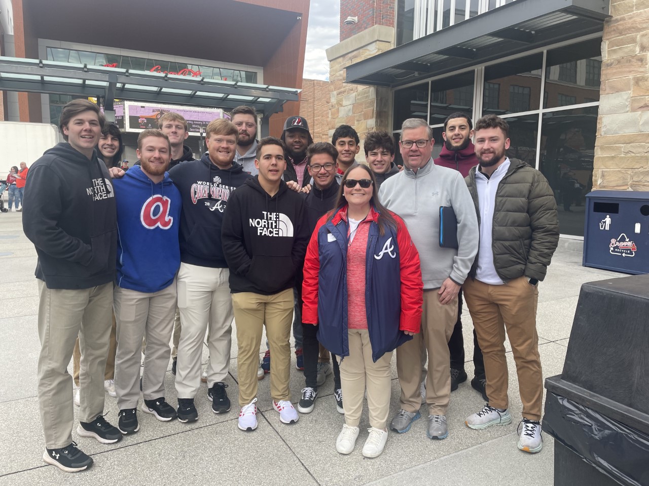 Business students working at sports event